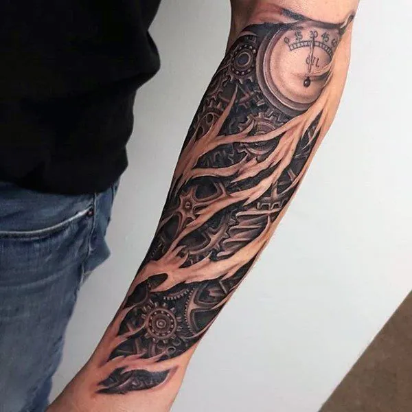 Black and grey forearm sleeve with dark organic patterning and a clock face near the elbow